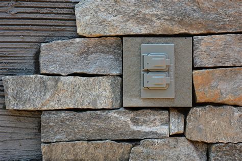 electrical box in stone wall|stone veneer electrical box.